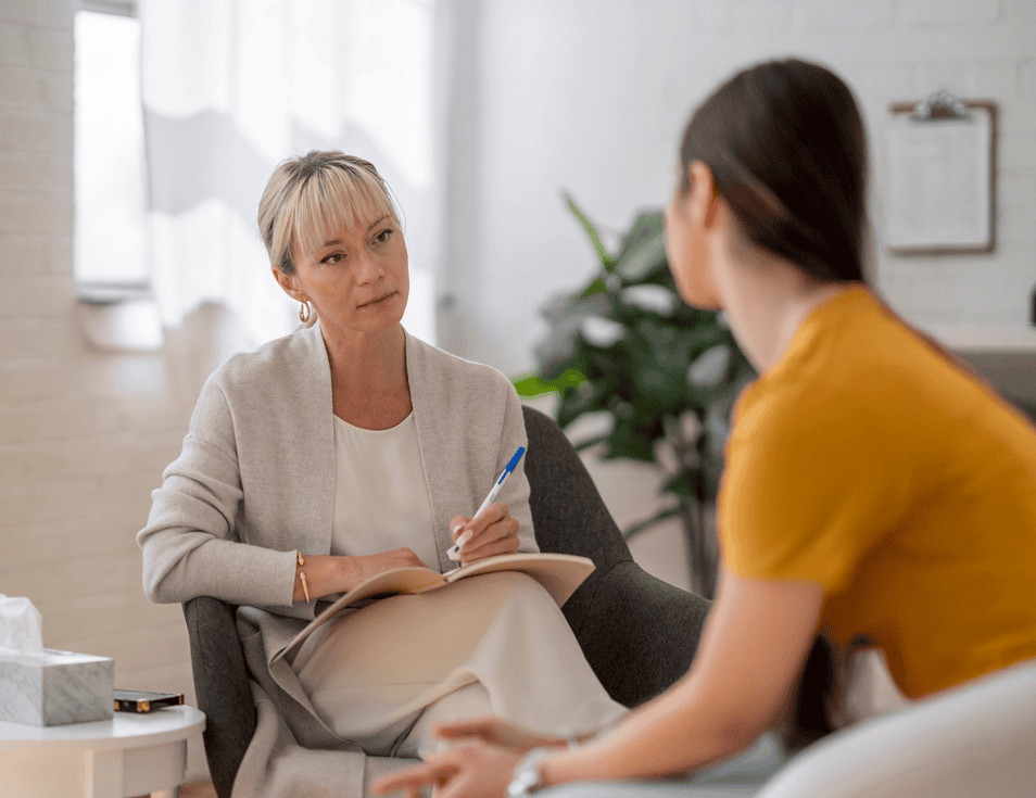 Therapist talking to patient
