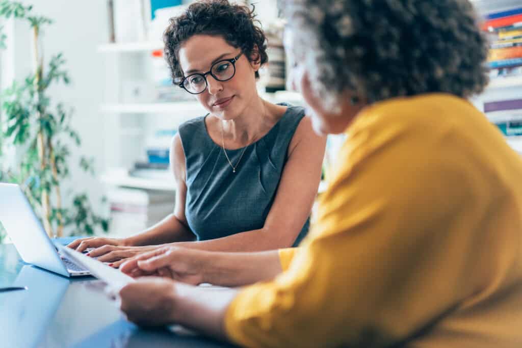 Manager discussing work with employee