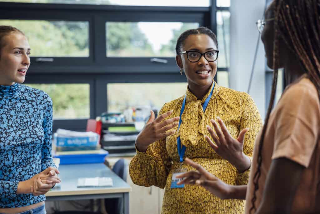 Three community social service workers having an animated conversation