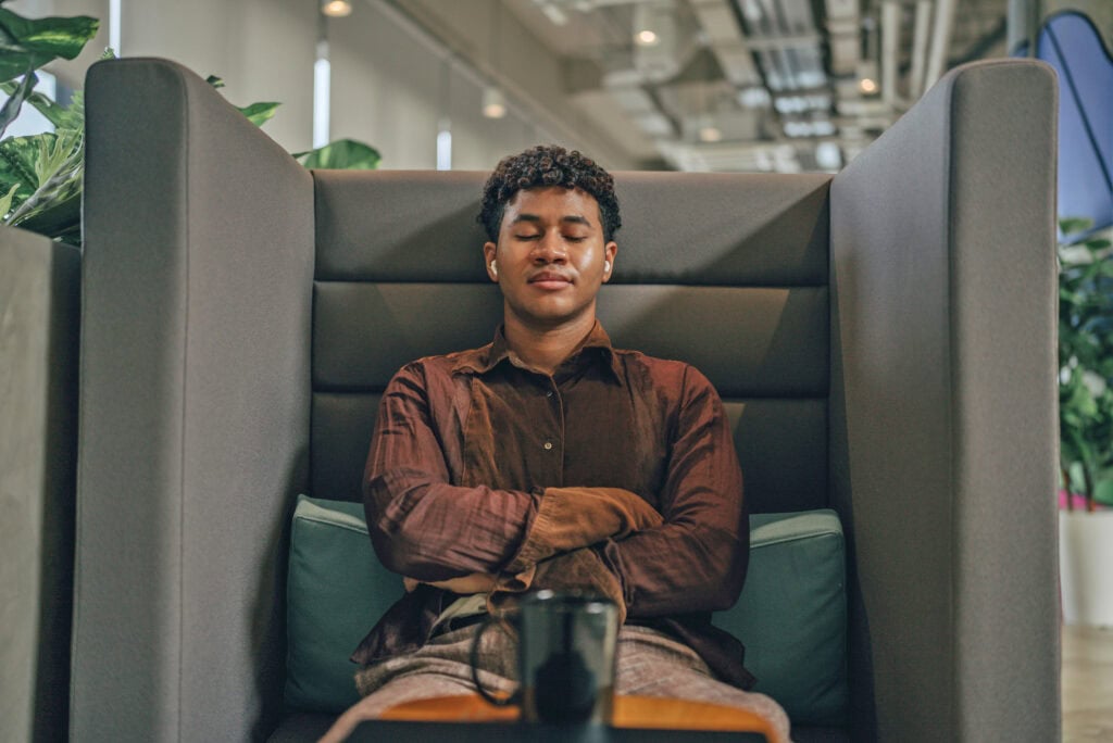 Employee on a lunch break taking a moment to meditate and ground themself