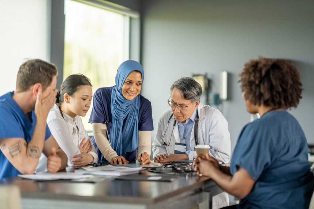 Nurse taking a leadership role and facilitating a session with her colleagues