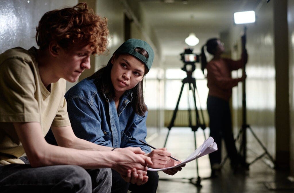 Two actors having a heart-to-heart conversation between filming scenes.